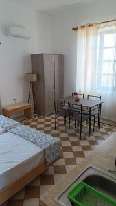 a room with a table and chairs in a room at San Marco Guesthouse in Kattavía +29 photos