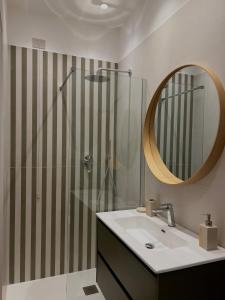 a bathroom with a sink and a shower with a mirror at Cledo Mare Luxury Stay - Armonia in Pescara +37 photos