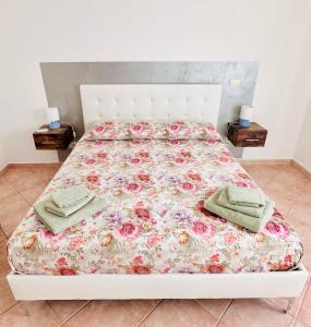 Postel nebo postele na pokoji v ubytování Gli Agrumi di nonna Peppina - Appartamento Arance
