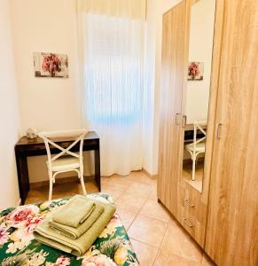 Postel nebo postele na pokoji v ubytování Gli Agrumi di nonna Peppina - Appartamento Arance