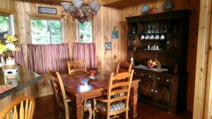 a dining room with a wooden table and chairs at Bryson City-Spectacular Views-Heaven's Gate in Bryson City