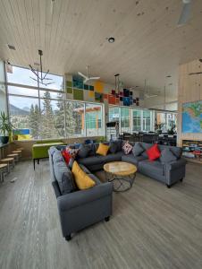 a living room with a couch and a table at Canmore Downtown Hostel in Canmore