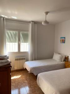 A bed or beds in a room at Casa Ricarda