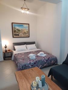Postel nebo postele na pokoji v ubytování Uva Nera House Oia