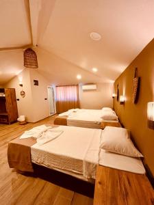 a hotel room with two beds in a room at Kalia Beach Hotel Side in Side