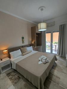 Postel nebo postele na pokoji v ubytování GIOTA ROOMS