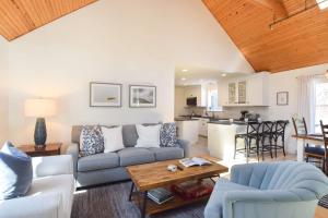 a living room with a couch and a table at 3000 Sq Ft Home with Hot Tub in Eastham