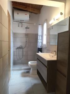 a bathroom with a shower and a toilet and a sink at Summer house, Μονοκατοικία 120 in Eretria