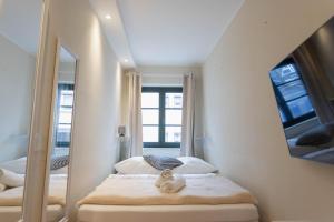 Postel nebo postele na pokoji v ubytování Ferienwohnung Baltic + 19 fotografií