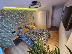 Ένα ή περισσότερα κρεβάτια σε δωμάτιο στο Puerto Chico Suite