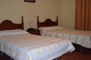 Ένα ή περισσότερα κρεβάτια σε δωμάτιο στο Hotel Río Seco