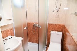 a bathroom with a shower and a toilet and a sink at Antonios Apartments in Ulcinj +141 photos