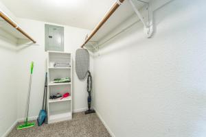 a room with a white wall and a shelf at Reserve At Westwood 3149 I Spacious 1 Bed 1 Bath in Houston +8 photos