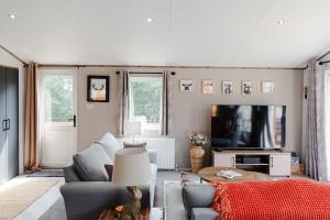 TV a/nebo společenská místnost v ubytování Tequila Sunrise - Ryde