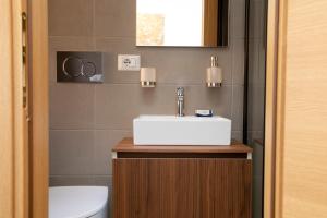 a bathroom with a sink and a toilet at Relais Rosselli in Rome