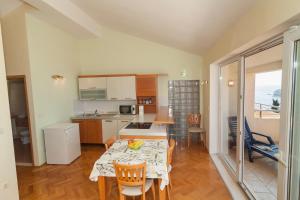 Kuchyň nebo kuchyňský kout v ubytování Apartments Simic