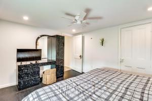 a bedroom with a bed and a ceiling fan at Ski, Hike and Fish Pet-Friendly Home in Saylorsburg in Saylorsburg