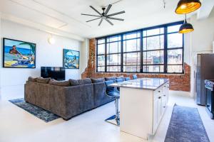 a living room with a couch and a table at Urban Retreat in Knoxville