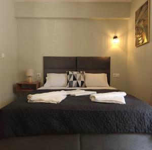 Postel nebo postele na pokoji v ubytování Nava Apartments
