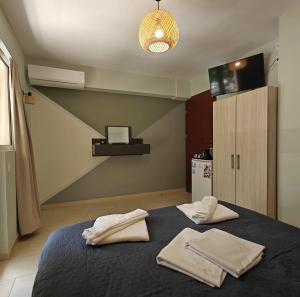 Postel nebo postele na pokoji v ubytování Nava Apartments