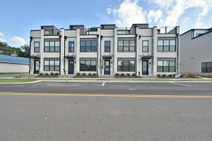 a large white building sitting on the side of a street at Waterfront Retreat in Knoxville