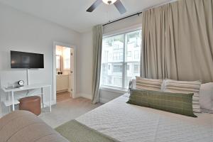 a living room with a couch and a large window at Waterfront Retreat in Knoxville