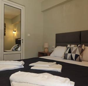 Postel nebo postele na pokoji v ubytování Nava Apartments