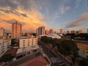 a view of a city at sunset with buildings at Studio in front of USP in São Carlos