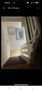 a picture of a staircase in a house at Eastgate Ensuite Room in London +1 photo
