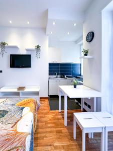 a living room with a couch and a table at Oropa 121 Apartment in Turin
