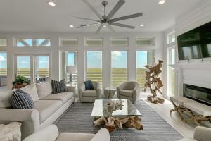 a living room with a couch and a fireplace at BeachHouse Bliss in Padre Island