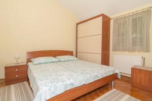 Postel nebo postele na pokoji v ubytování Apartments Simic