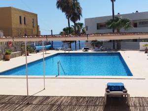an empty swimming pool in a building at Sol del Sur Ocean View in Puerto de Santiago