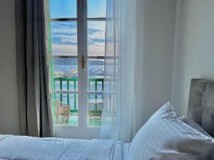 Ένα ή περισσότερα κρεβάτια σε δωμάτιο στο Sunset View garden house of Mykonos