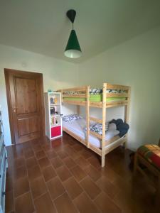Postel nebo postele na pokoji v ubytování TOT'I Dè BARACA