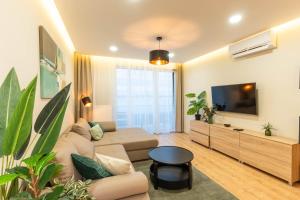 TV a/nebo společenská místnost v ubytování Lakeside Panorama Apartment 115