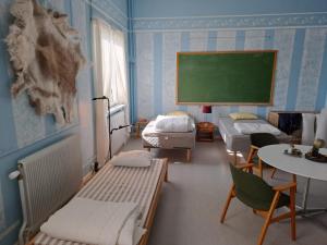 Letto o letti in una camera di Skolan