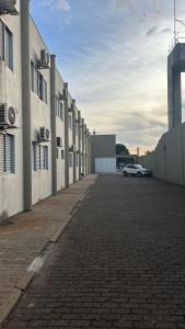 a car parked in a parking lot next to a building at Havana Express Uberaba in Uberaba