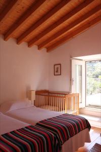 En eller flere senge i et værelse på Quinta d'Abegoa