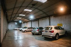 a group of cars parked in a parking garage at Nuevo Hotel Pacifico in Mendoza