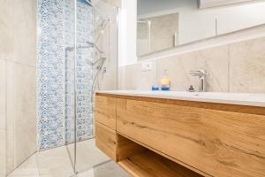 a bathroom with a sink and a shower at Tra il Borgo e il Mare - Bel Horizonte in Capoliveri