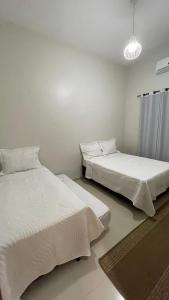 CASA TEMPORADA BARREIRINHAS Yellow 4客房内的一张或多张床位