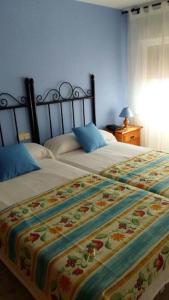 Posteľ alebo postele v izbe v ubytovaní Hostal Mainz