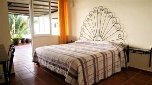 Postel nebo postele na pokoji v ubytování Casa Rinconsito Miramar