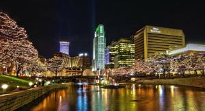a city lit up at night with christmas lights at Welcome to Luigi! in Omaha