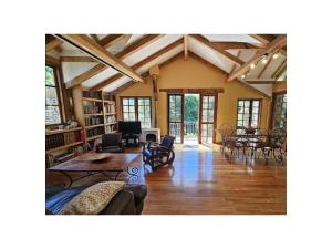 a large living room with a table and chairs at Holiday Apartment Segura 2 in Oletta