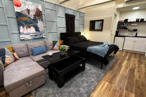 a living room with a couch and a table at Hurricane Homestead Rentals in Hurricane