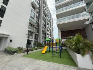 a playground in front of a apartment building at Edificio Salinas del Mar - Pozos Colorados in Santa Marta