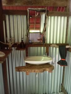 a bathroom with a sink and a mirror at Salvaje trip in Nuquí +27 photos