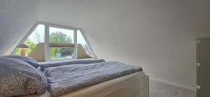 Кровать или кровати в номере Finnenhütte "MH77"